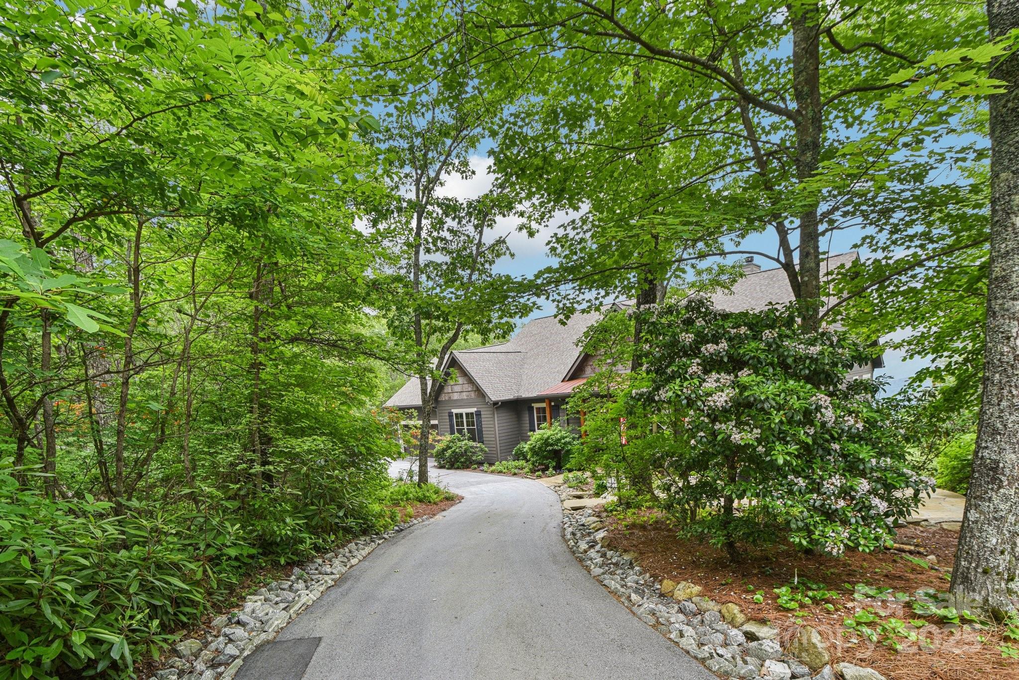 71 Raptor Way Sapphire, NC 28774 - Photo 4 of 46 a view of a garden