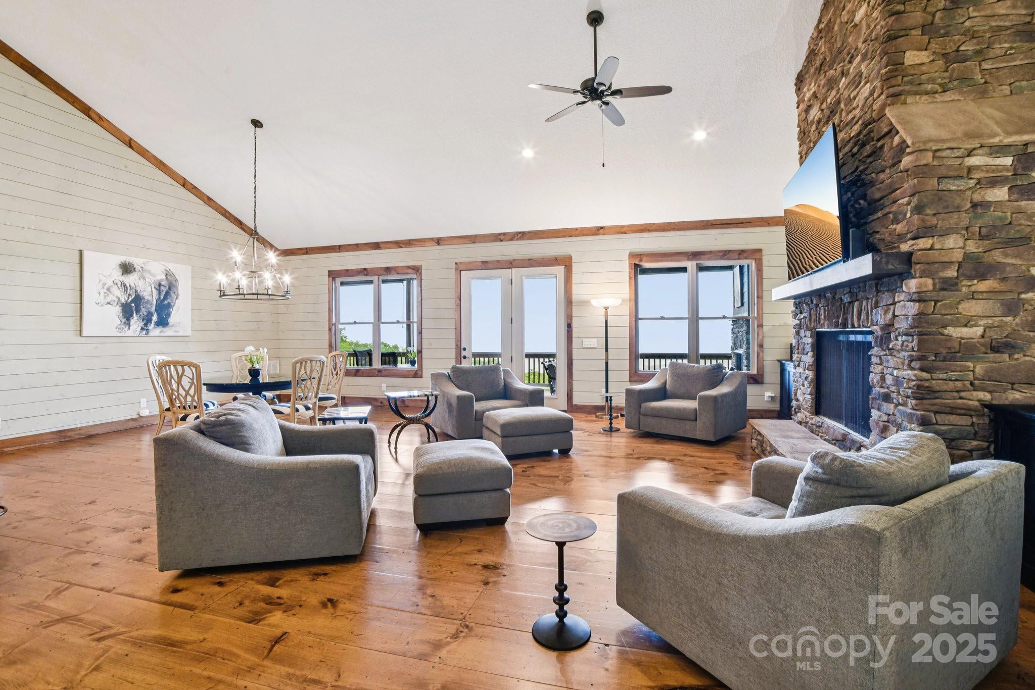 71 Raptor Way Sapphire, NC 28774 - Photo 10 of 46 a living room with furniture and a fireplace