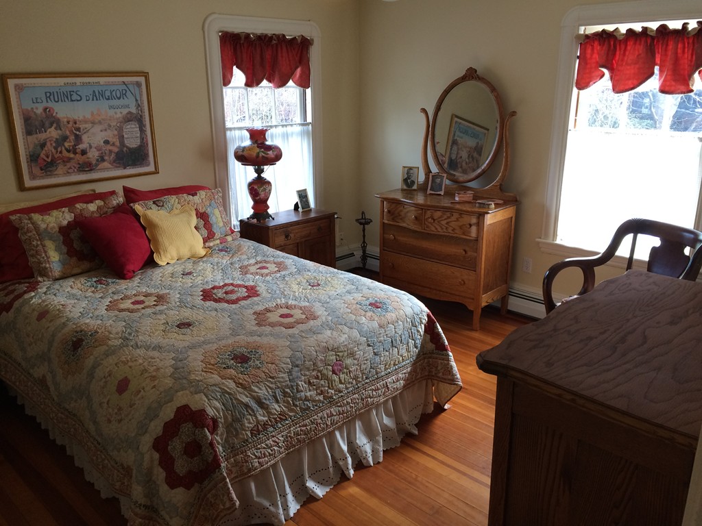 100 Salisbury Road Brookline, MA 02445 - Photo 15 of 22 a bedroom with a bed and a dresser with wooden floor