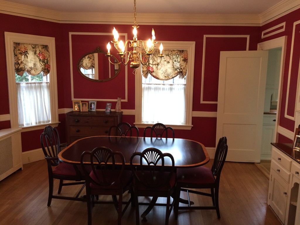 100 Salisbury Road Brookline, MA 02445 - Photo 5 of 22 a view of a dining room with furniture a chandelier and wooden floor