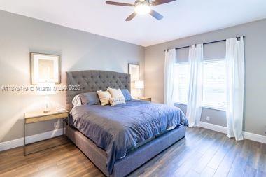 8525 Pine Cay West Palm Beach, FL 33411 - Photo 20 of 40 a bedroom with a bed and window