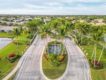8525 Pine Cay West Palm Beach, FL 33411 - Photo 2 of 40 a view of swimming pool from a balcony