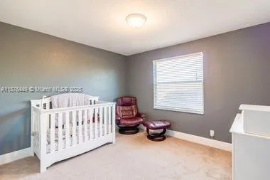 a bedroom with a bed and a table