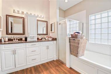 8525 Pine Cay West Palm Beach, FL 33411 - Photo 28 of 40 a bathroom with double vanity and a bathtub