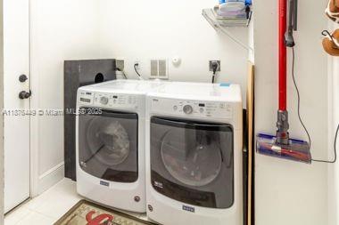 8525 Pine Cay West Palm Beach, FL 33411 - Photo 31 of 40 a utility room with a washer and dryer