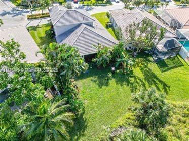 8525 Pine Cay West Palm Beach, FL 33411 - Photo 34 of 40 a view of a garden with a house