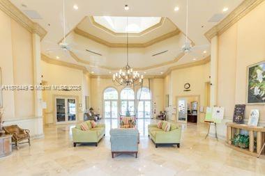 8525 Pine Cay West Palm Beach, FL 33411 - Photo 35 of 40 a living room with furniture and a chandelier