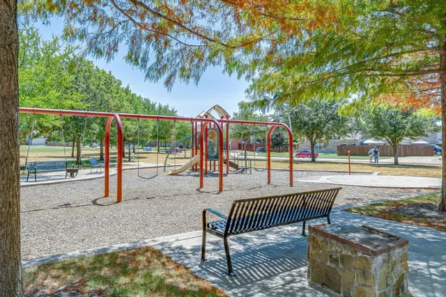 a view of a deck with couches and wooden fence