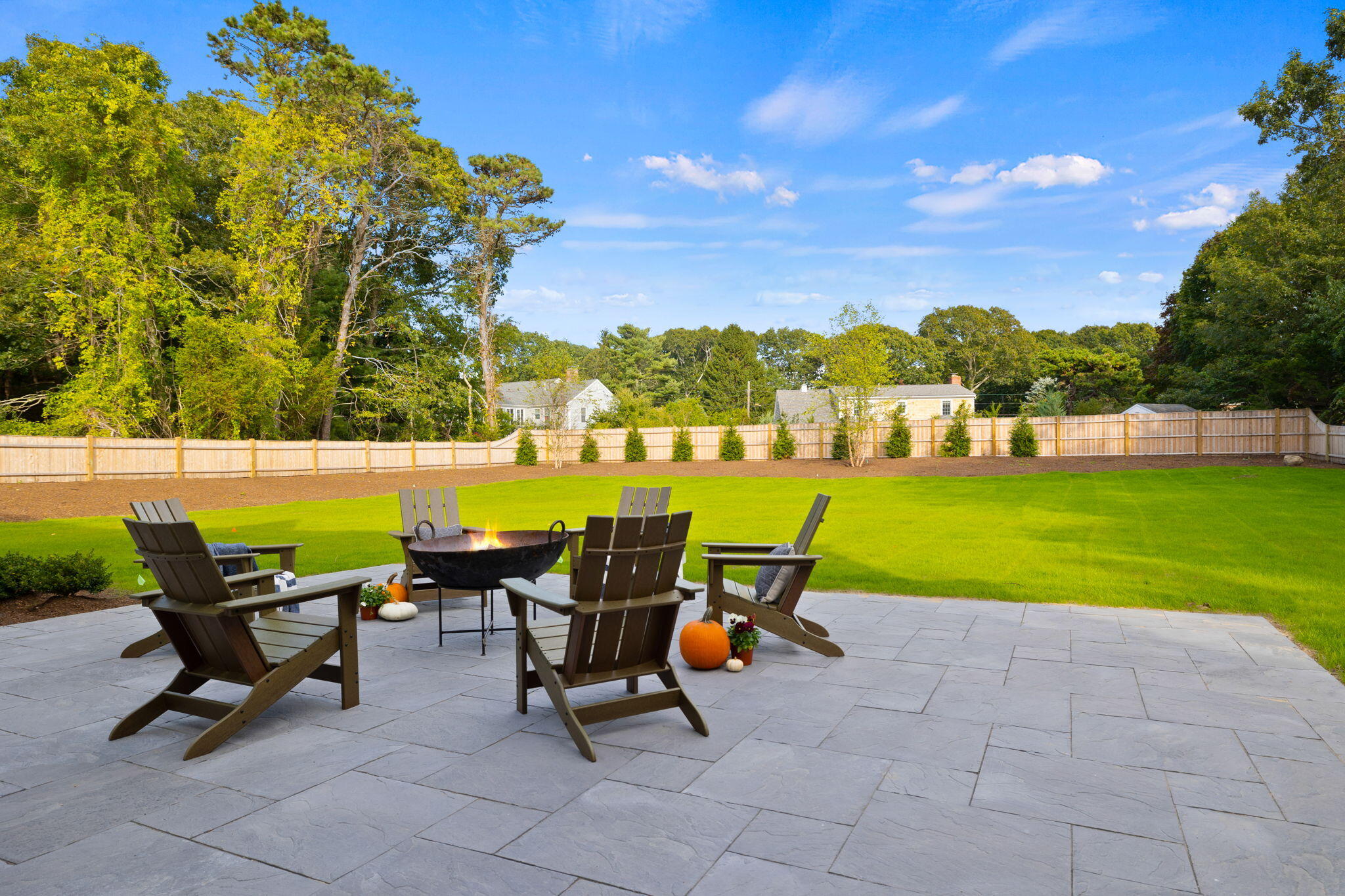 76 Old Mill Road Osterville, MA 02655 - Photo 12 of 45 a view of a chairs and table on the terrace