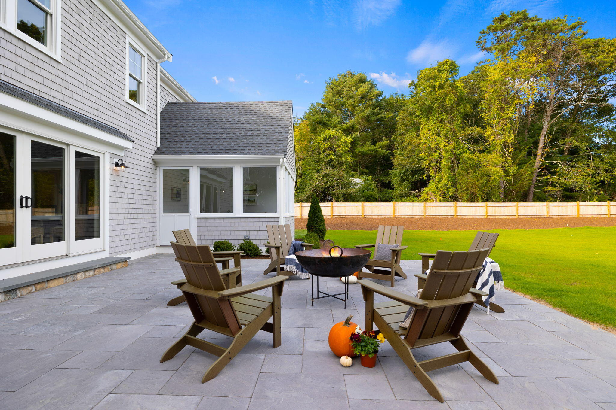 76 Old Mill Road Osterville, MA 02655 - Photo 13 of 45 a backyard of a house with table and chairs