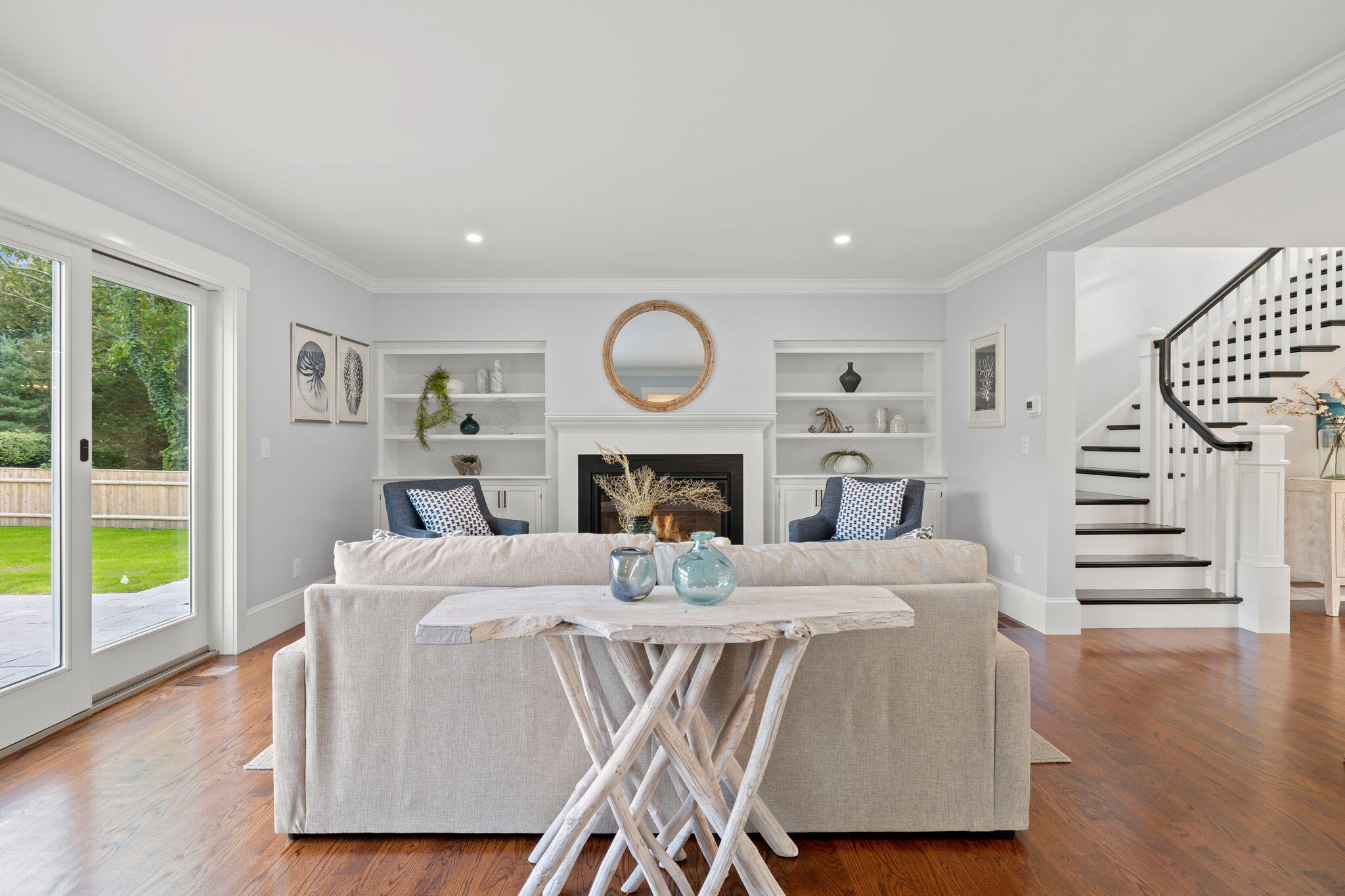 76 Old Mill Road Osterville, MA 02655 - Photo 16 of 45 a living room with furniture and a fireplace