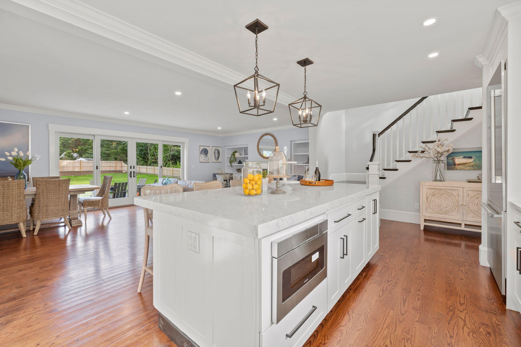 76 Old Mill Road Osterville, MA 02655 - Photo 22 of 45 a large kitchen with stainless steel appliances granite countertop a stove and wooden floor