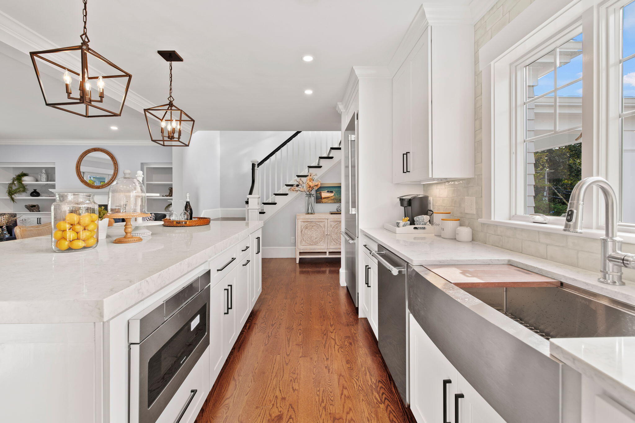 76 Old Mill Road Osterville, MA 02655 - Photo 23 of 45 a kitchen with granite countertop a sink a stove top oven and cabinets