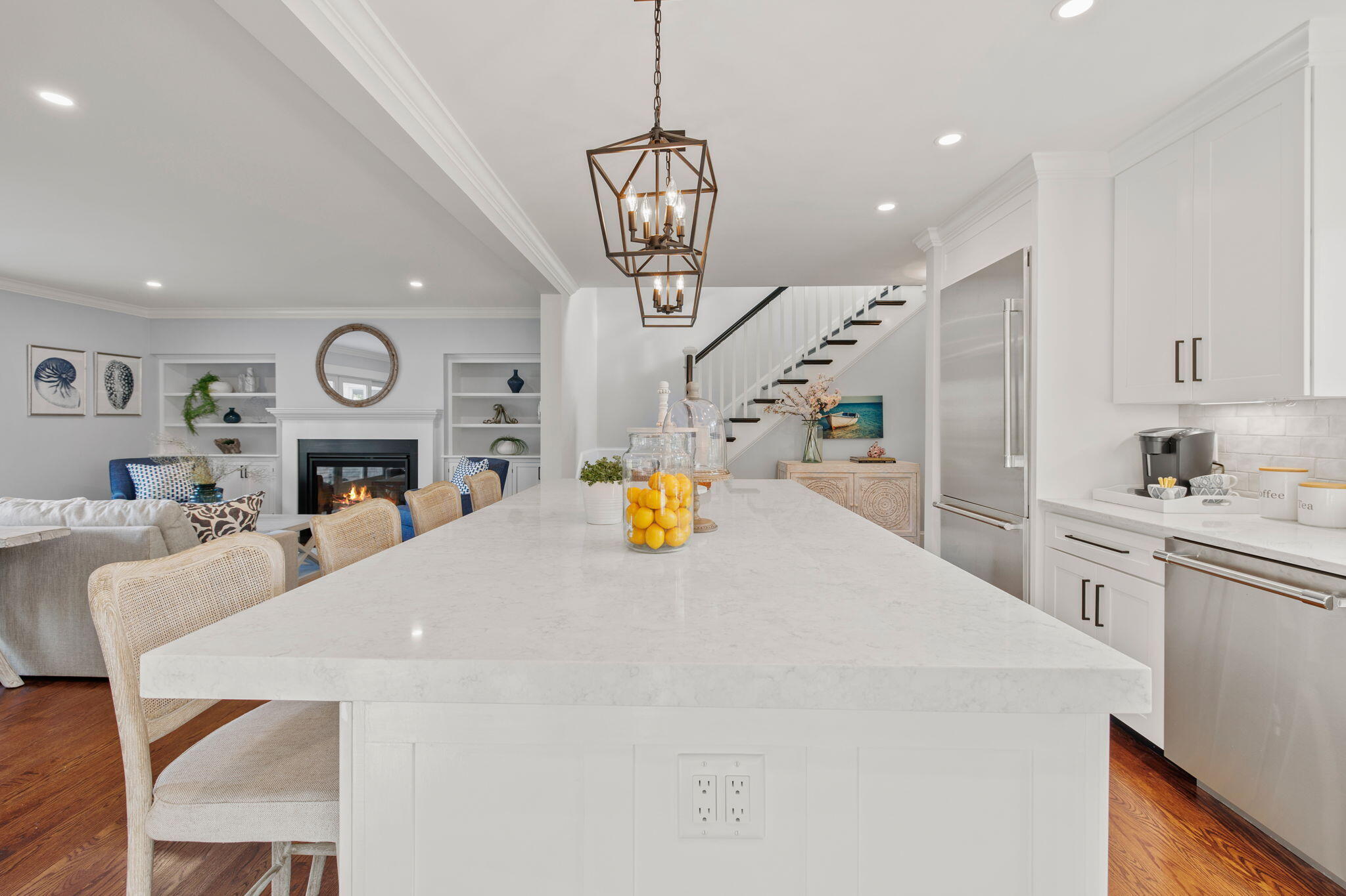 76 Old Mill Road Osterville, MA 02655 - Photo 24 of 45 a kitchen with stainless steel appliances kitchen island granite countertop a stove a sink a dining table and chairs with wooden floor
