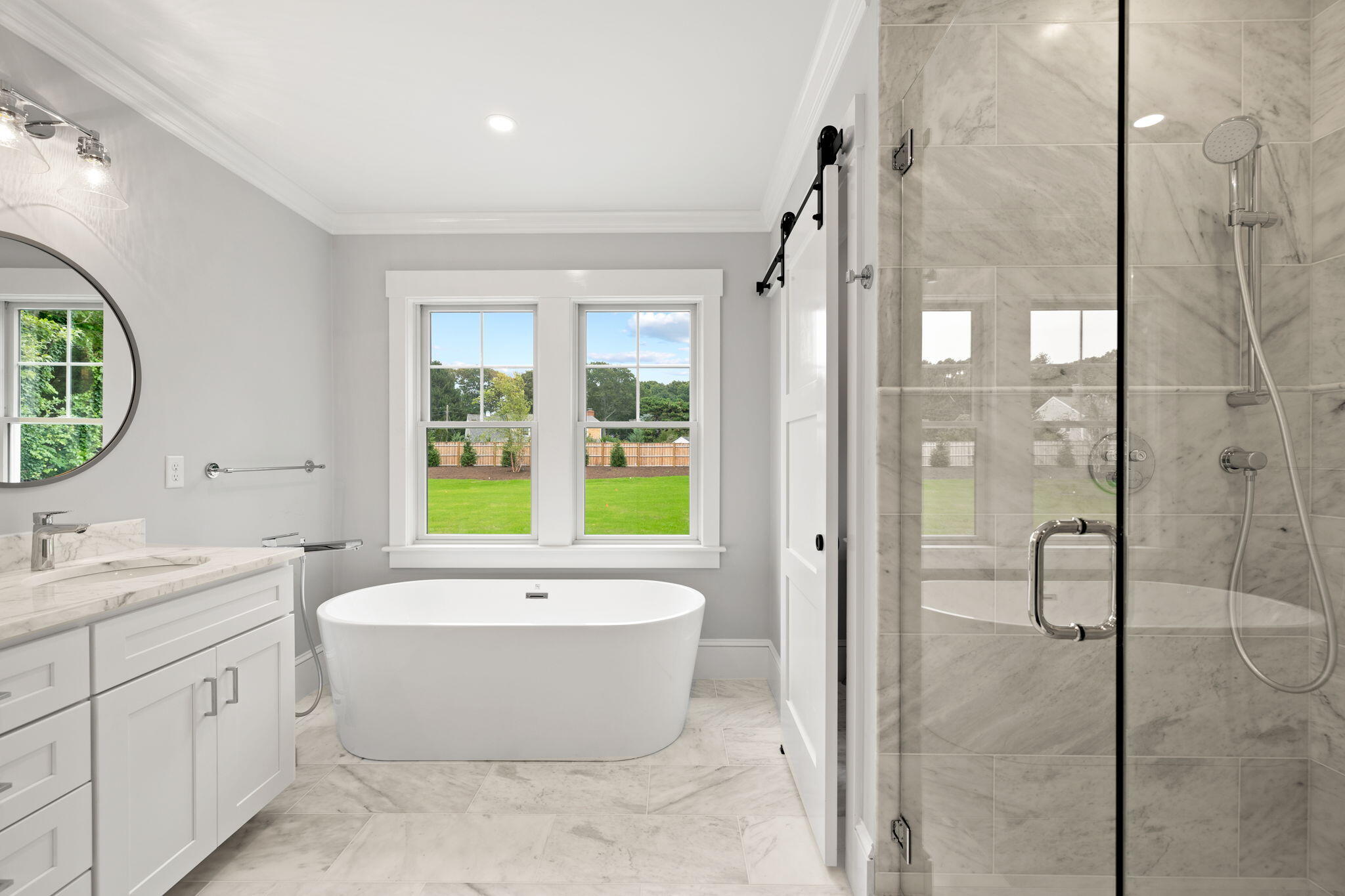 76 Old Mill Road Osterville, MA 02655 - Photo 31 of 45 a bathroom with a tub sink shower and mirror