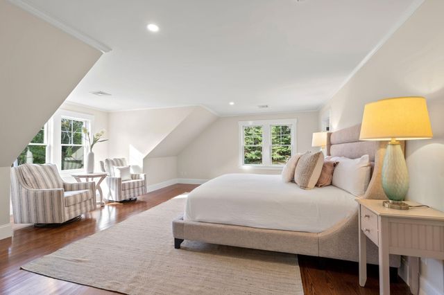 a bedroom with a beds and a couch