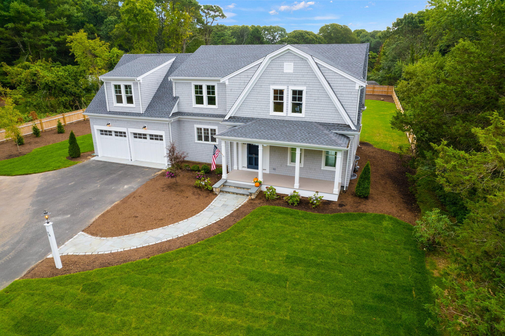 76 Old Mill Road Osterville, MA 02655 - Photo 45 of 45 front view of a house with a yard