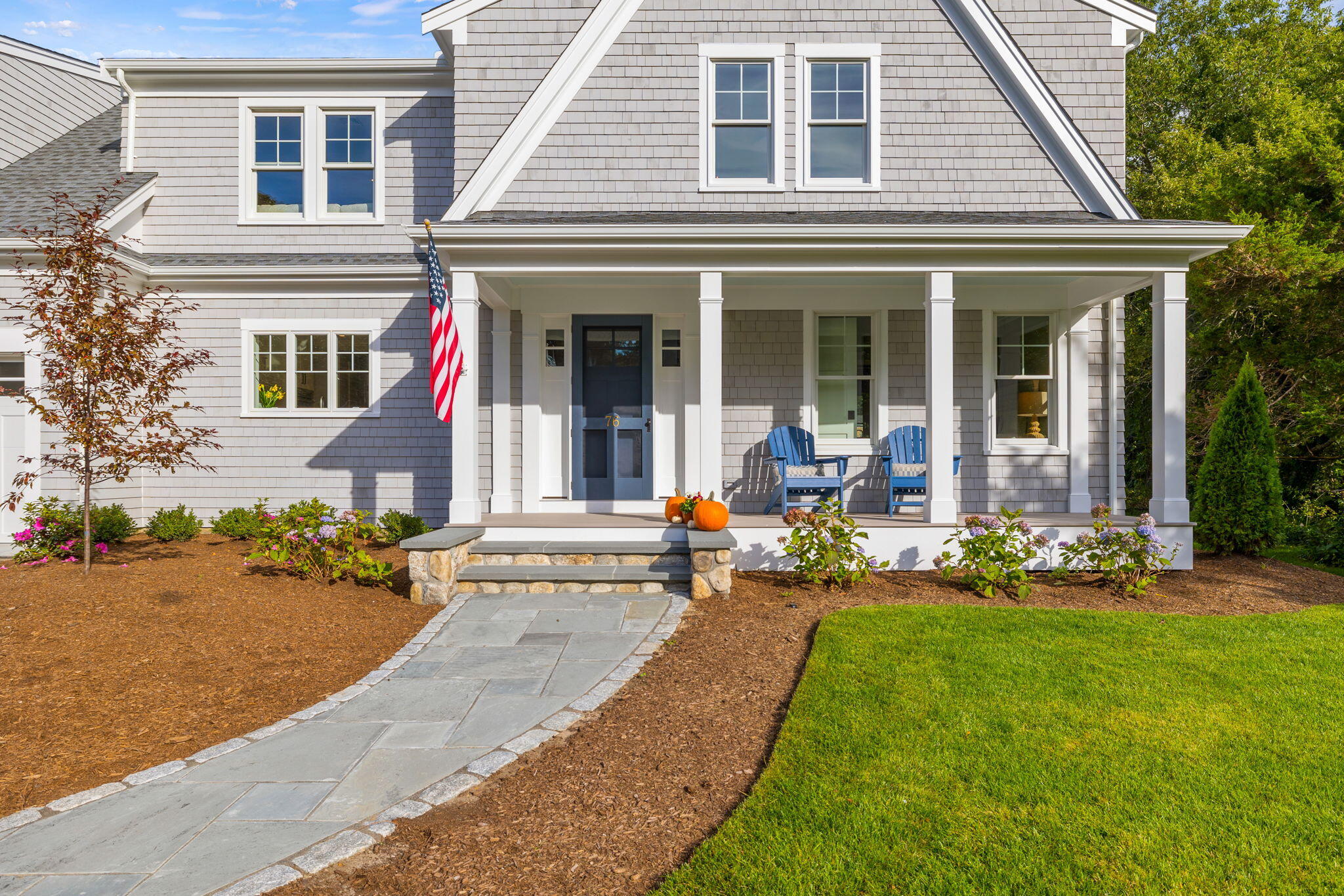 76 Old Mill Road Osterville, MA 02655 - Photo 10 of 45 front view of a house with a patio