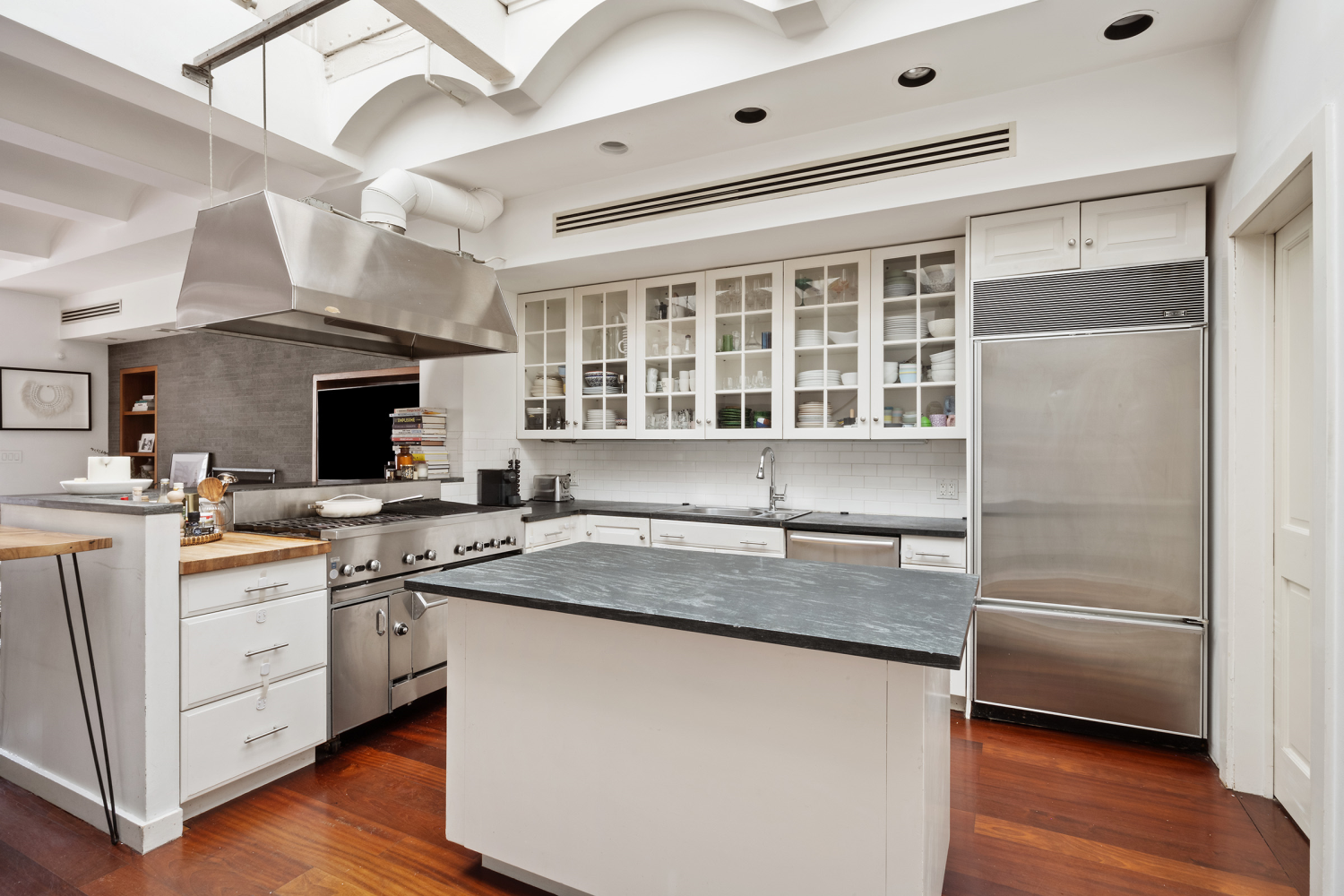 176 Franklin Street, Unit PH Manhattan, NY 10013 - Photo 5 of 5 a kitchen with a sink and cabinets