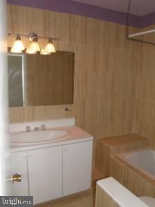 1856 Kalorama Road Northwest, Unit 5 Washington, DC 20009 - Photo 4 of 4 a bathroom with a sink and mirror