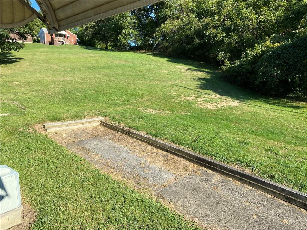 906 Maple Street Ruffs Dale, PA 15679 - Photo 4 of 13 a view of yard with swimming pool and outdoor seating