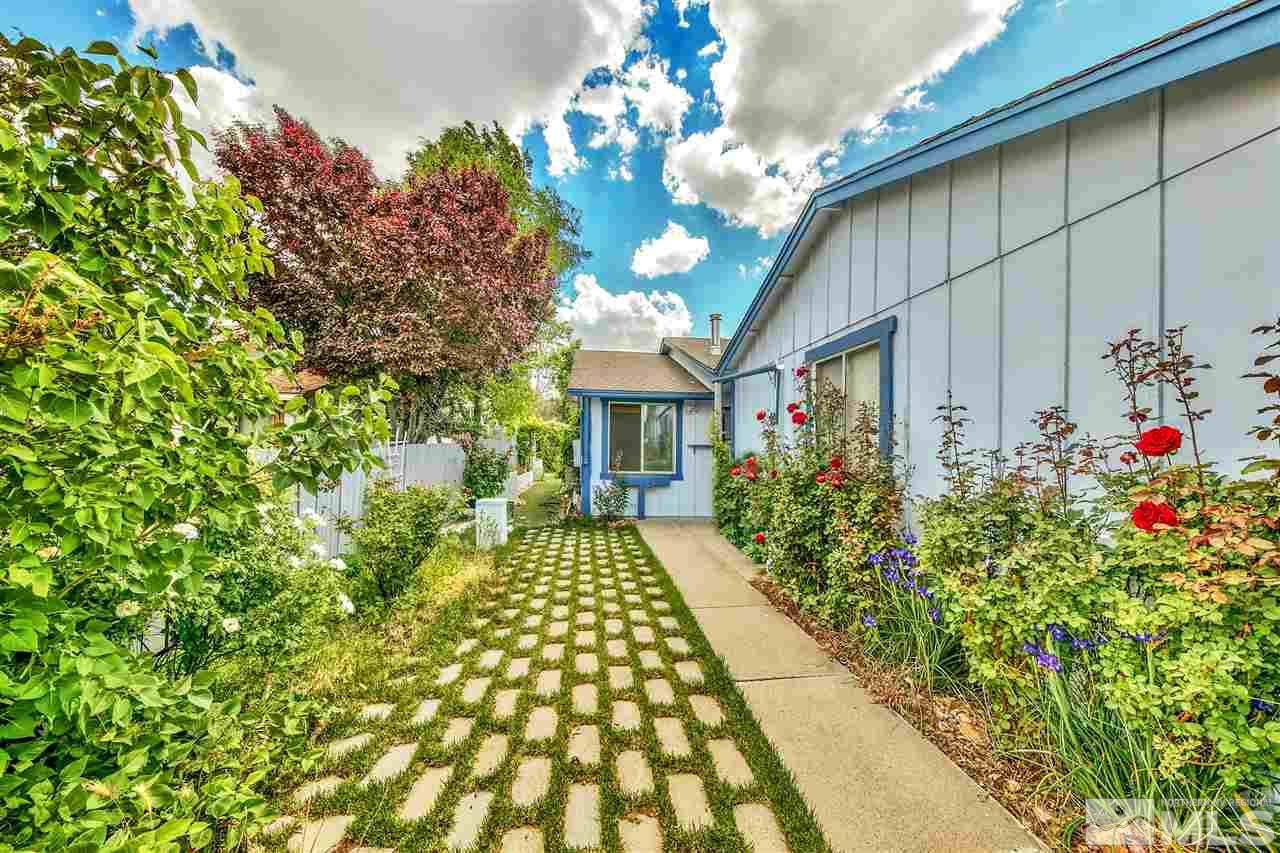 6640 Lotus Street Reno, NV 89506 - Photo 1 of 20 a front view of a house with a yard