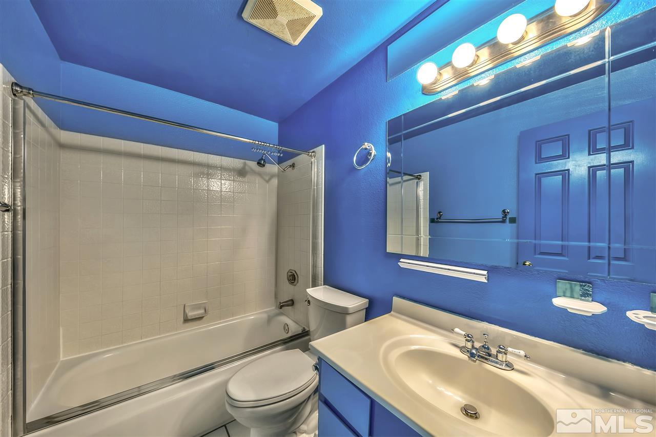6640 Lotus Street Reno, NV 89506 - Photo 15 of 20 a bathroom with a sink toilet and shower