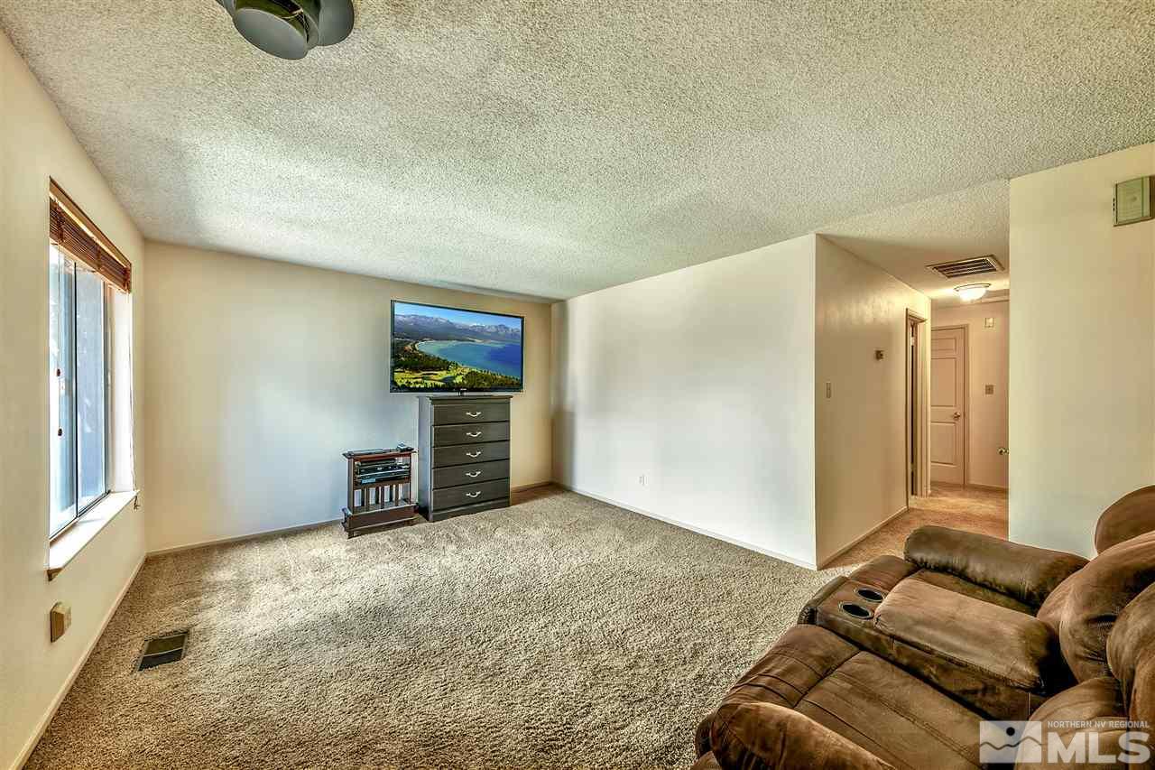 6640 Lotus Street Reno, NV 89506 - Photo 7 of 20 a living room with furniture and a flat screen tv