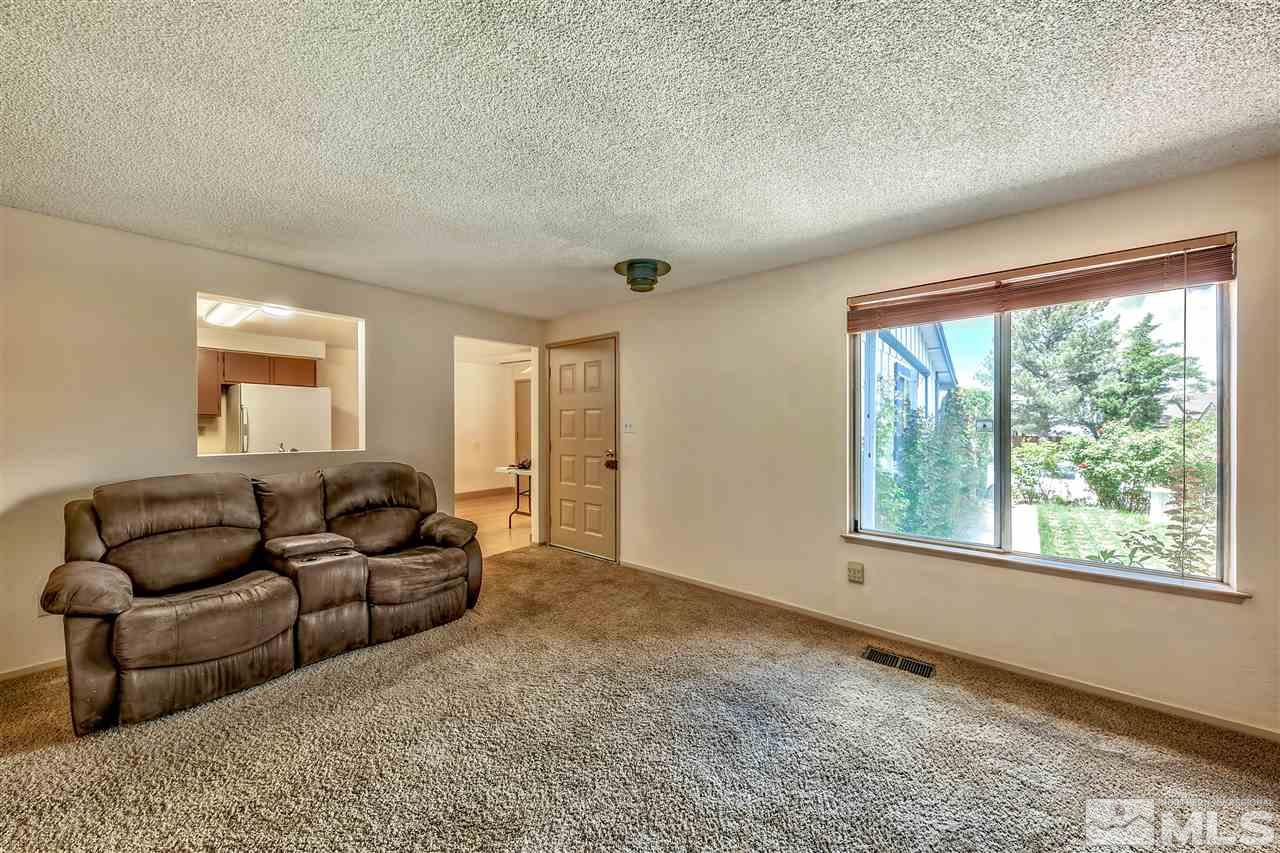 6640 Lotus Street Reno, NV 89506 - Photo 8 of 20 a living room with furniture and a large window