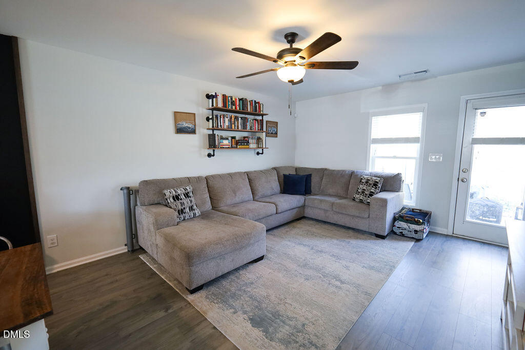 230 South Raleigh Street Angier, NC 27501 - Photo 14 of 38 a living room with furniture and a large window