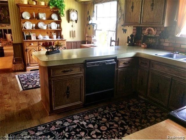 844 Peach Tree Lane Rochester, MI 48306 - Photo 20 of 37 Newer wood flooring in kitchen. Plenty of cabinet space.