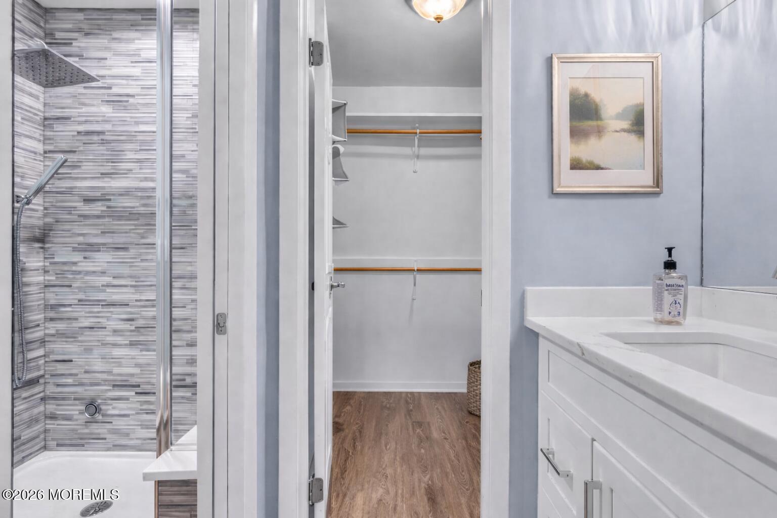 22 Claremont Court Red Bank, NJ 07701 - Photo 13 of 28 a bathroom with a sink and a mirror