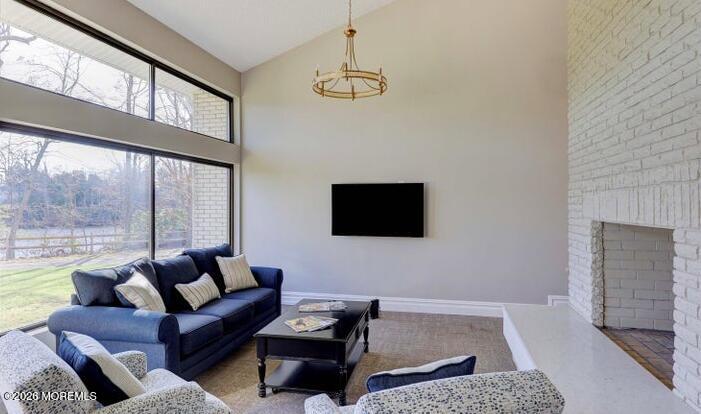 22 Claremont Court Red Bank, NJ 07701 - Photo 27 of 28 a living room with furniture a flat screen tv and a fireplace