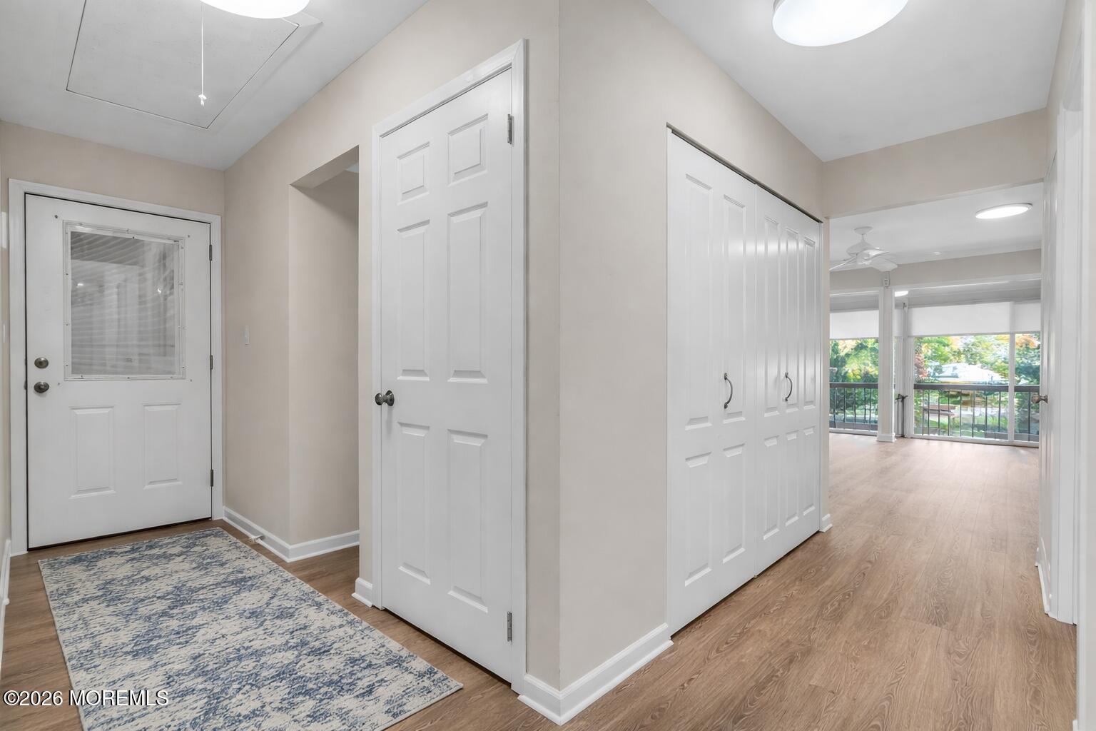 22 Claremont Court Red Bank, NJ 07701 - Photo 3 of 28 a view of a hallway with wooden floor and cabinet