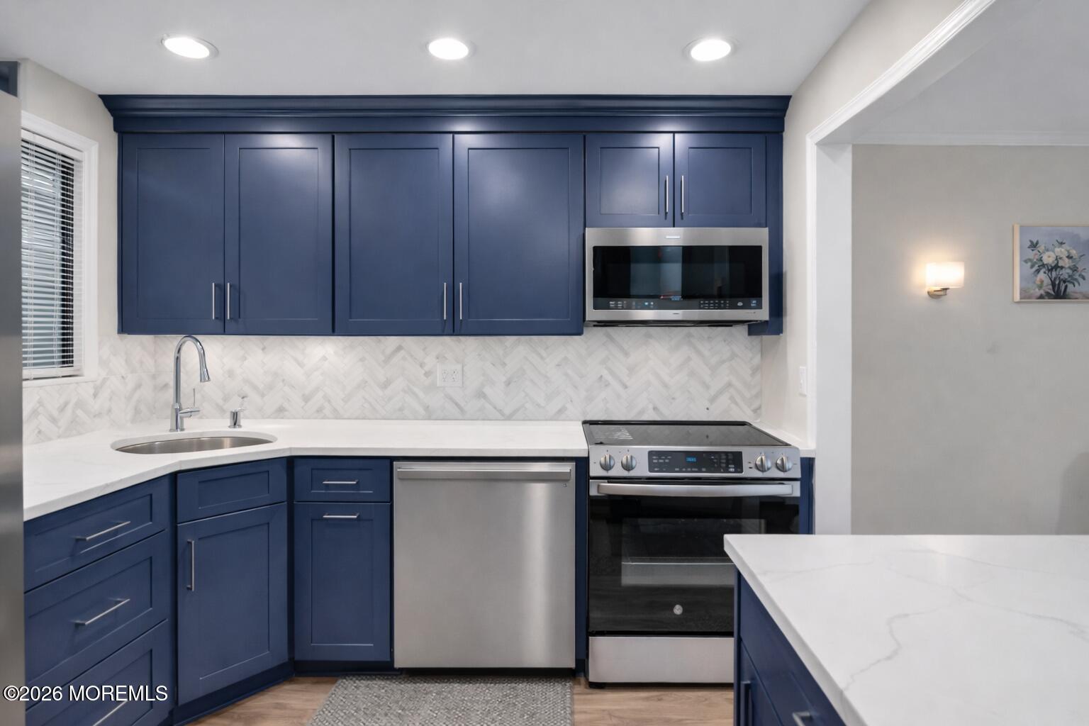 22 Claremont Court Red Bank, NJ 07701 - Photo 5 of 28 a kitchen with a sink and a stove top oven