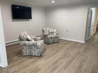 22 Claremont Court Red Bank, NJ 07701 - Photo 9 of 28 a living room with furniture and a flat screen tv