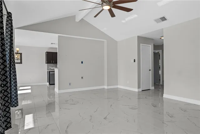 a view of a livingroom with a ceiling fan
