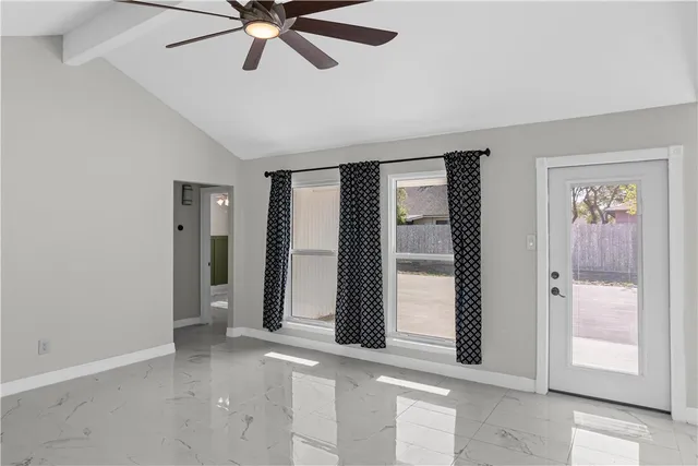 a view of an entryway with wooden floor