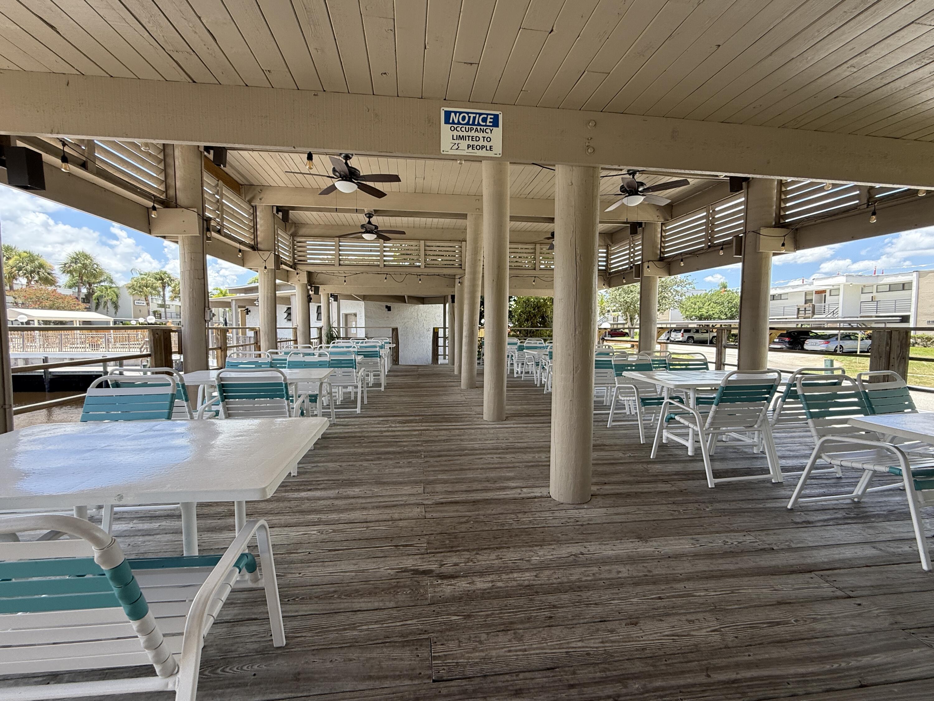 1950 Southwest Palm City Road, Unit 5109 Stuart, FL 34994 - Photo 29 of 41 a view of a hall with wooden floor