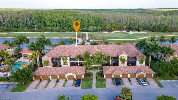 an aerial view of house with a garden