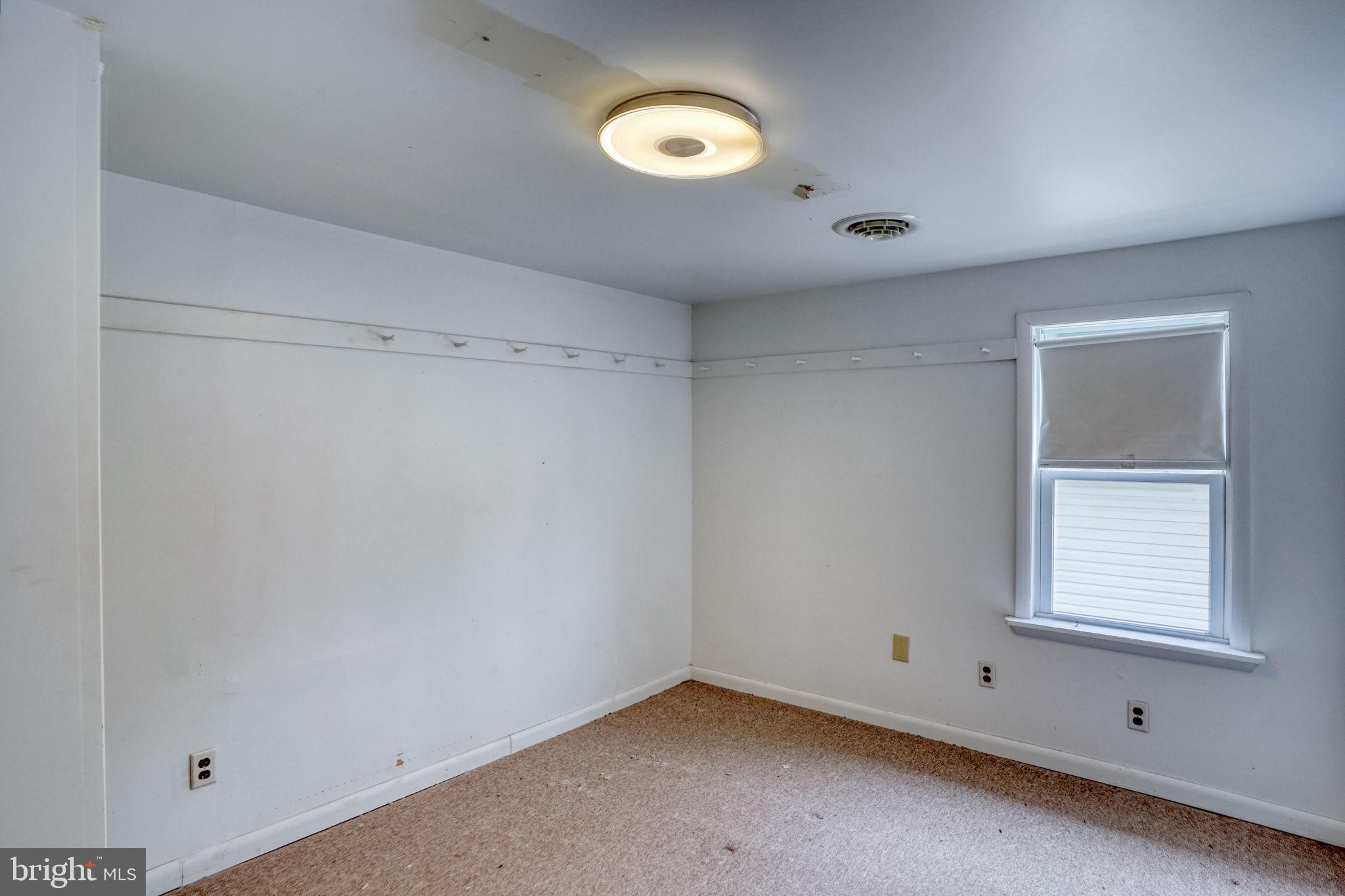 257 Front Street Leipsic, DE 19901 - Photo 23 of 37 a view of an empty room with a window