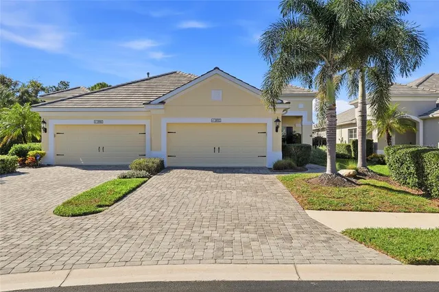 a view of garage and a yard