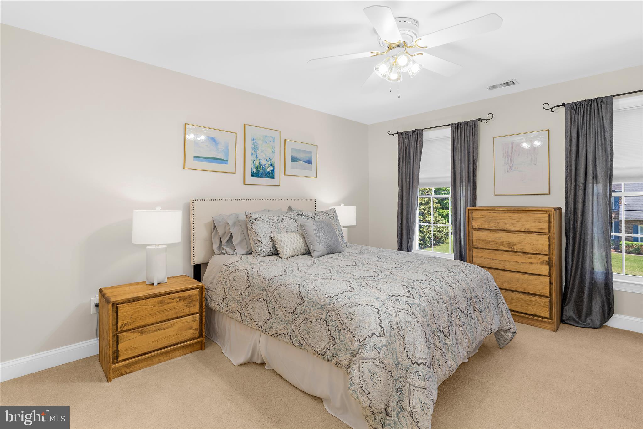 1848 Cherry Road Annapolis, MD 21409 - Photo 19 of 57 a spacious bedroom with a bed and a chandelier