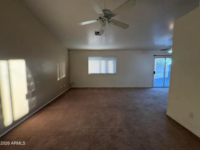a view of a big room with windows and cabinet