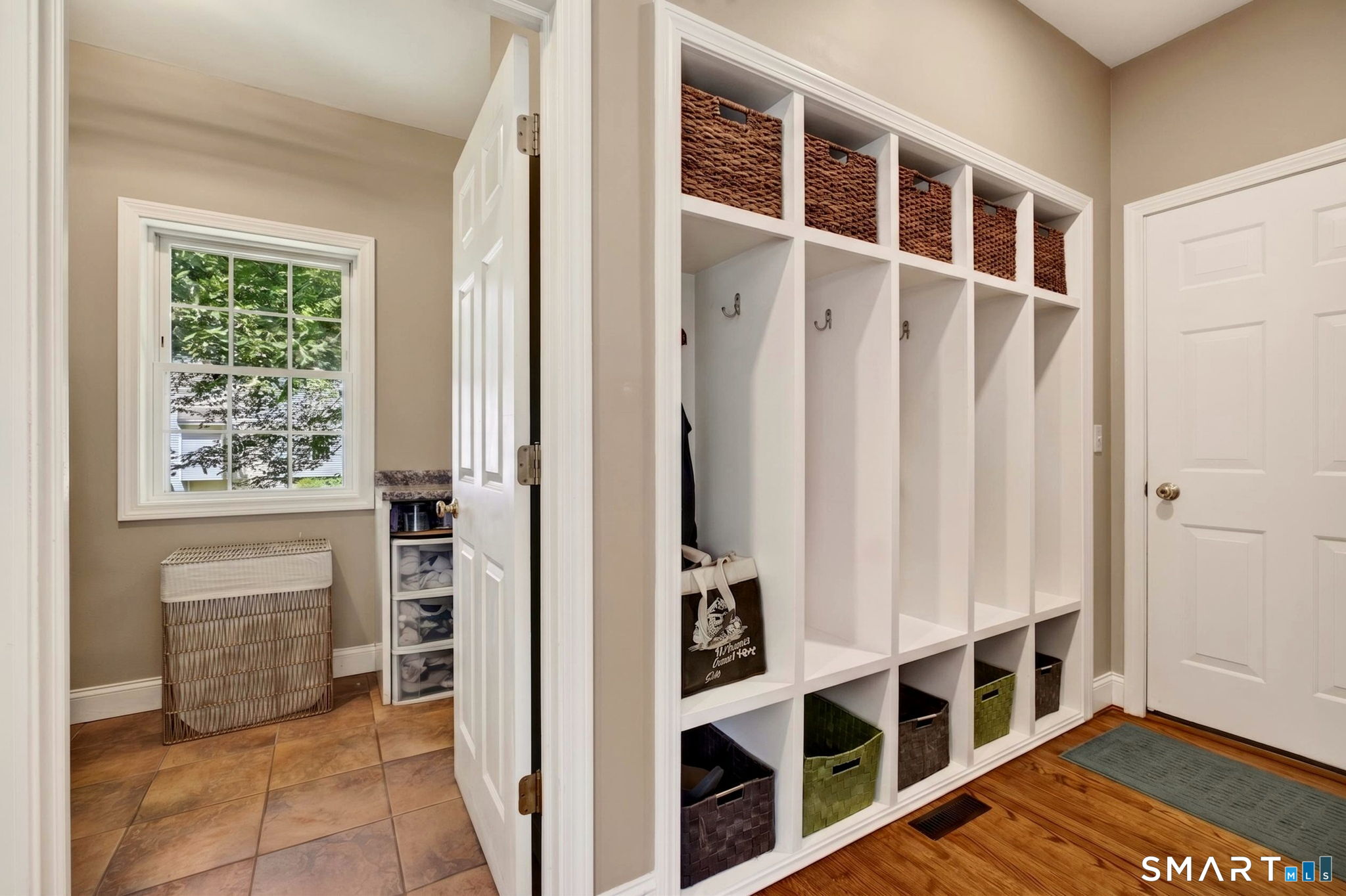 89 Falls Landing Road Deep River, CT 06417 - Photo 21 of 40 Entrance to Pantry and Laundry With Coat and Bag Cubices