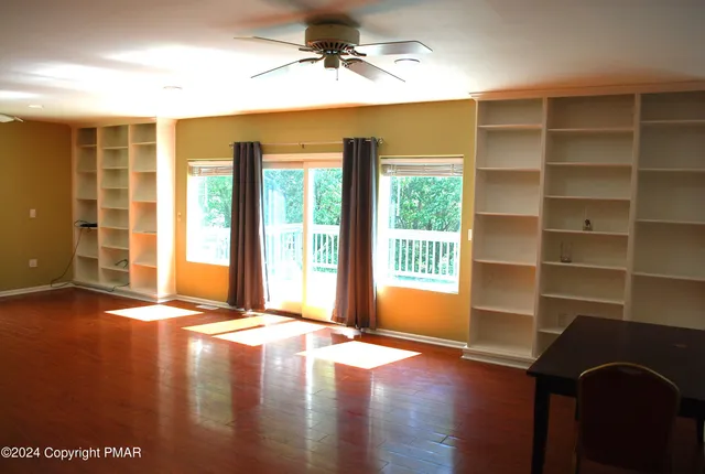 a kitchen with a sink cabinets and a window