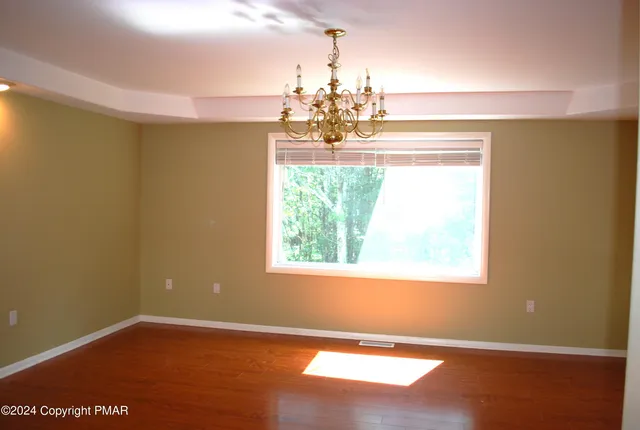 a bathroom with a toilet a sink and a mirror
