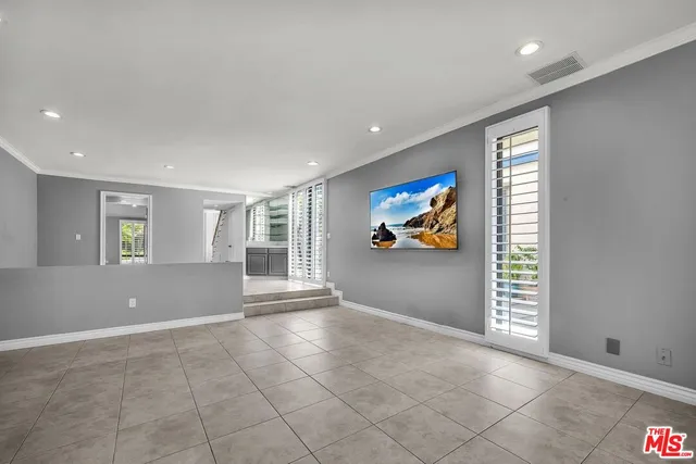 a view of a kitchen with a sink and a window