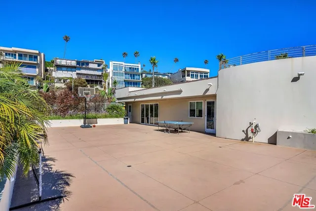 a living room with furniture a rug and a window