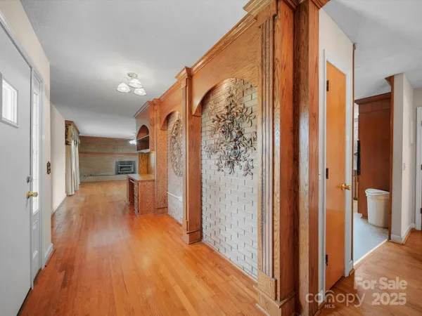 a view of livingroom with hardwood floor and a ceiling fan
